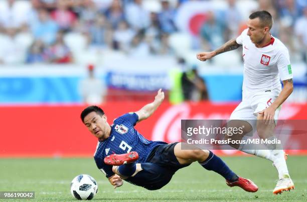 Shinji Okazaki of Japan competes with Jacek Goralski of Poland during the 2018 FIFA World Cup Russia group H match between Japan and Poland at...