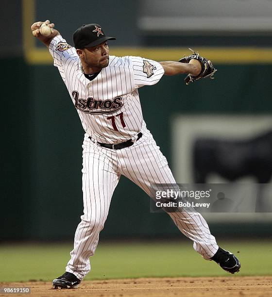 Third baseman Pedro Feliz of the Houston Astros throws to first base against the Florida Marlins at Minute Maid Park on April 21, 2010 in Houston,...