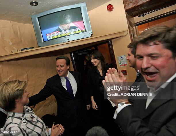Conservative Party Leader David Cameron and his wife Samantha are applauded by supporters as they arrive at the Three Suga Loaves pub following the...