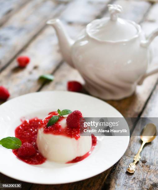 delicious italian dessert panna cotta with raspberry sauce and m - raspberry sauce stock pictures, royalty-free photos & images