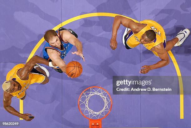 Nenad Krstic of the Oklahoma City Thunder rebounds against Ron Artest and Andrew Bynum of the Los Angeles Lakers in Game Two of the Western...