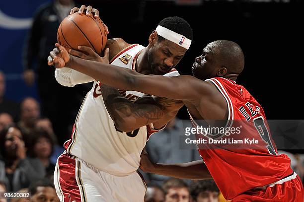 LeBron James of the Cleveland Cavaliers handles the ball against Luol Deng of the Chicago Bulls in Game Two of the Eastern Conference Quarterfinals...