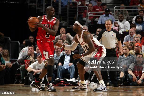 Luol Deng of the Chicago Bulls handles the ball against LeBron James of the Cleveland Cavaliers in Game Two of the Eastern Conference Quarterfinals...