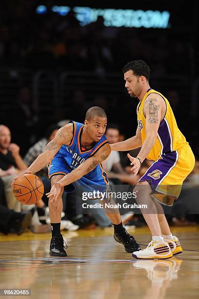 Eric Maynor of the Oklahoma City Thunder moves the ball against Jordan Farmar of the Los Angeles Lakers in Game Two of the Western Conference...