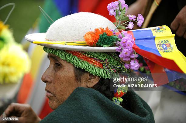 An indigenous Quechua woman with Venezuelan flags on her hat is seen during a World Climate Change Conference at the Feliz Capriles stadium in...