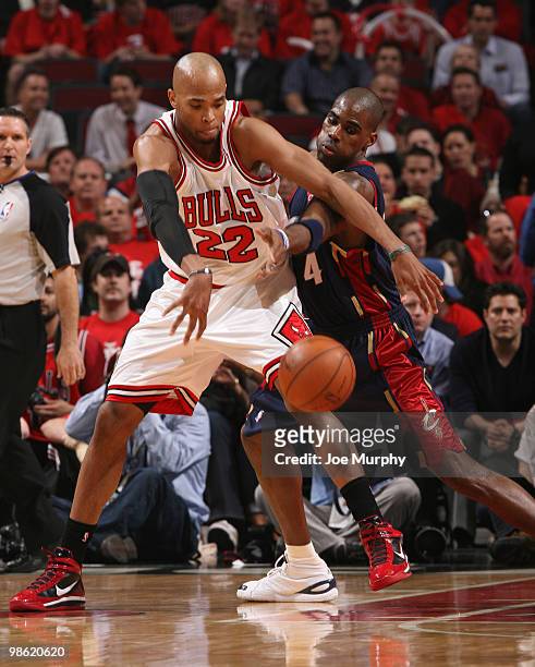 Taj Gibson of the Chicago Bulls battles for control of the ball withAntawn Jamison of the Cleveland Cavaliers in Game Three of the Eastern Conference...