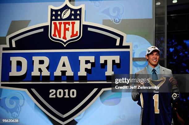 Quarterback Sam Bradford of the Oklahoma Soomers holds up a St. Louis Rams jersey after he was picked numer 1 overall by the Rams during the 2010 NFL...