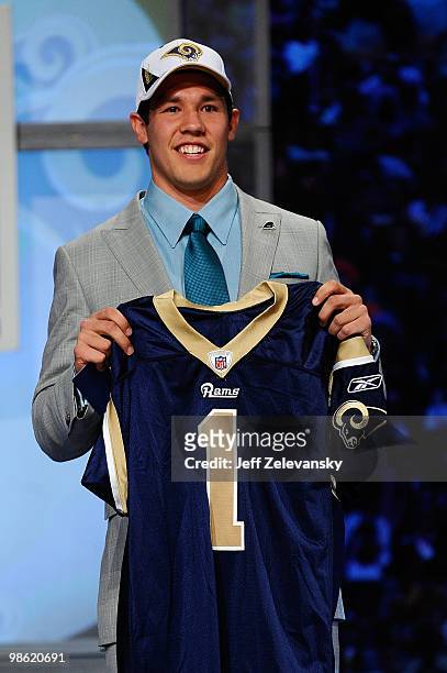 Quarterback Sam Bradford of the Oklahoma Soomers holds up a St. Louis Rams jersey after he was picked numer 1 overall by the Rams during the 2010 NFL...