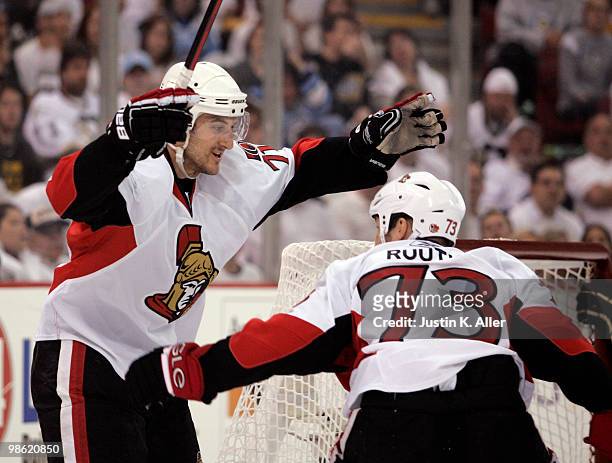 Nick Foligno of the Ottawa Senators celebrates with Jarkko Ruutu after scoring against the Pittsburgh Penguins in Game Five of the Eastern Conference...
