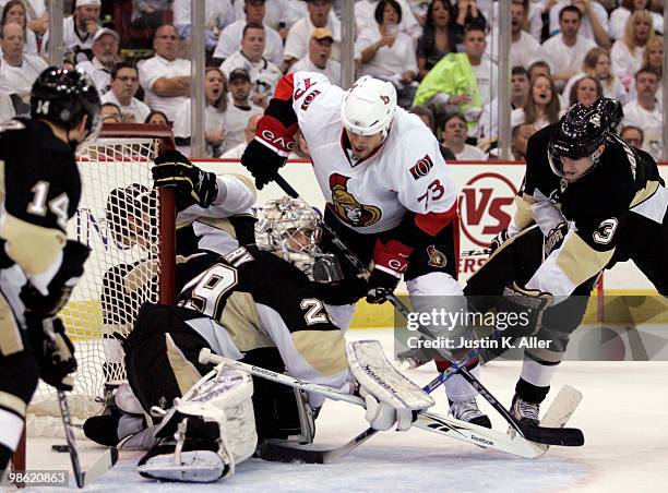 Jarkko Ruutu of the Ottawa Senators slips a puck past Marc-Andre Fleury of the Pittsburgh Penguins in Game Five of the Eastern Conference...