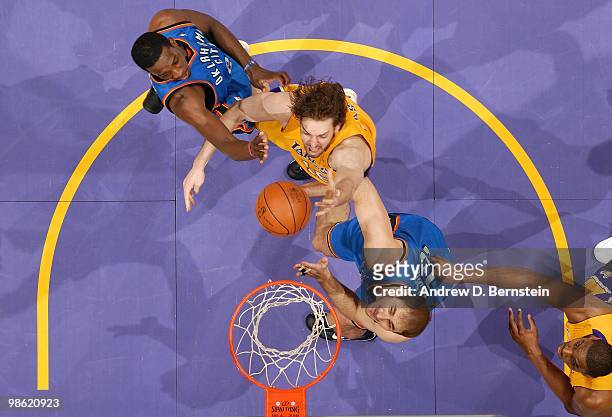 Pau Gasol of the Los Angeles Lakers shoots a layup against Jeff Green and Nenad Krstic of the Oklahoma City Thunder in Game Two of the Western...