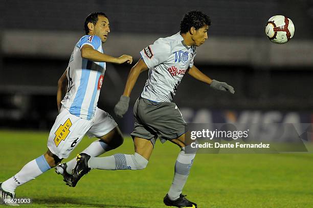 Sebastian Suarez of Uruguay's Cerro vies for the ball Robin Rojas of Ecuador's Emelec during their Libertadores Cup match at the Centenario Stadium...