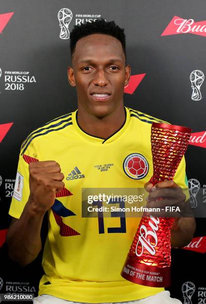 Yerry Mina of Colombia poses with his Man of the Match trophy following his performance in the 2018 FIFA World Cup Russia group H match between...