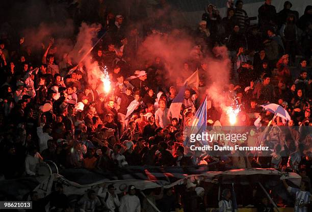 Cerro's fans cheer their team up during their match against Emelec as part of the Libertadores Cup 2010 at the Centenario stadium on April 22, 2010...