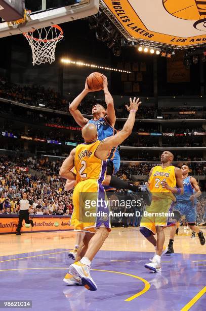 Thabo Sefolosha of the Oklahoma City Thunder goes up for a shot against Derek Fisher of the Los Angeles Lakers in Game Two of the Western Conference...