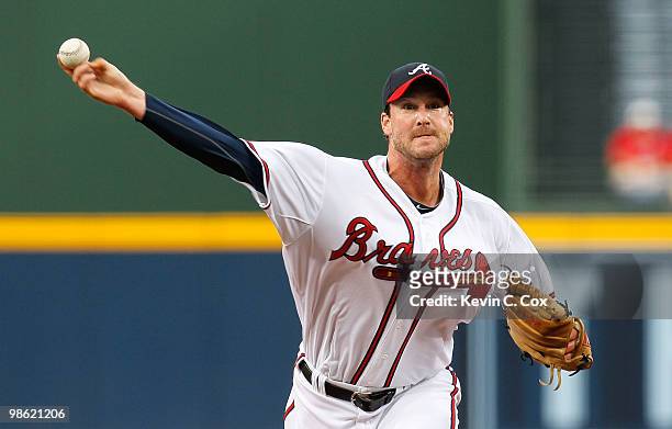 Starting pitcher Derek Lowe of the Atlanta Braves pitches in the first inning against the Philiadelphia Phillies at Turner Field on April 22, 2010 in...