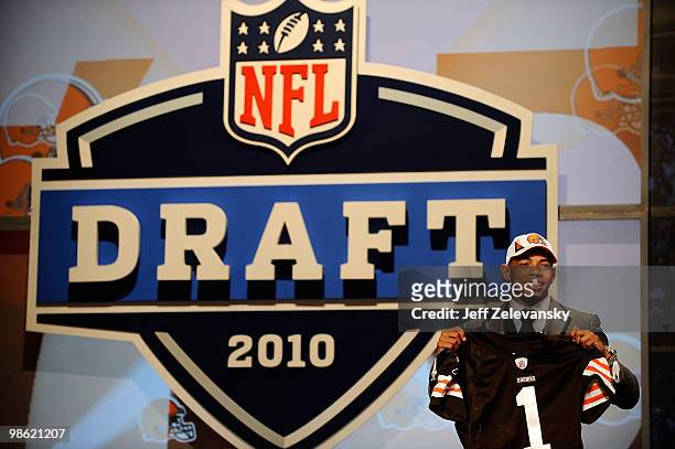 Joe Haden from the Florida Gators holds up a Cleveland Browns jersey after he was selected overall by the Browns during the first round of the 2010...