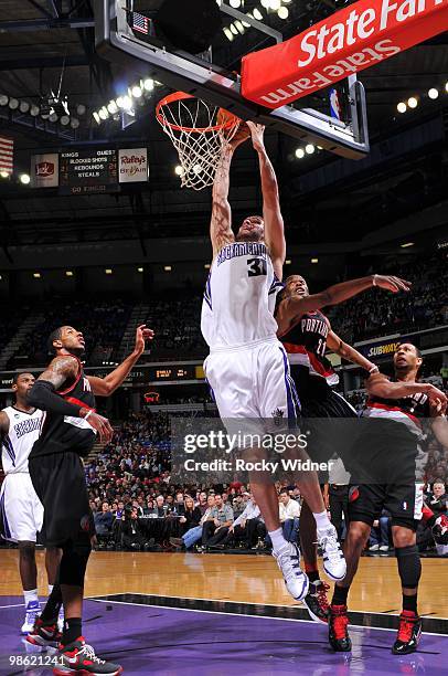 Spencer Hawes of the Sacramento Kings goes up for the slam dunk against the Portland Trail Blazers during the game on March 12, 2010 at Arco Arena in...