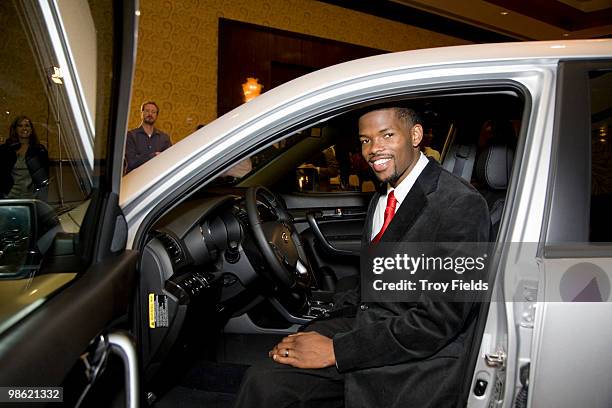 Aaron Brooks of the Houston Rockets checks out the 2011 Kia Sorento that will be donated to the Boys and Girls Club of Great Houston April 22, 2010...