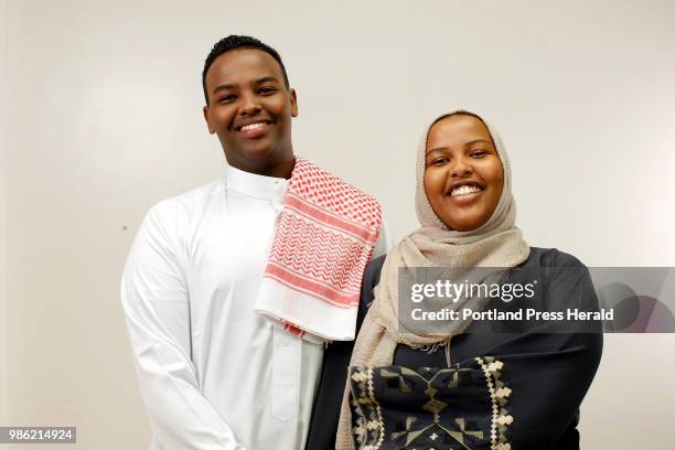 Twin siblings Abdihakim and Ridwana Atoor pose for a portrait on Friday morning before Eid prayers at Portland Expo. .