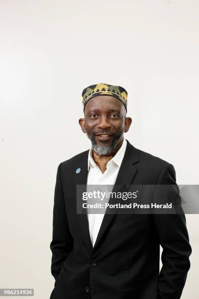 Portland City Councilor Pious Ali poses for a portrait on Friday morning before Eid prayers at Portland Expo.