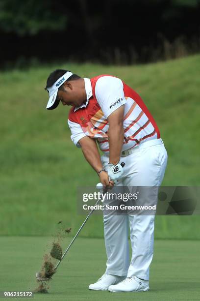 Kiradech Aphibarnrat of Thailand plays a shot on the 18th fairway during the first round of the Quicken Loans National at TPC Potomac on June 28,...