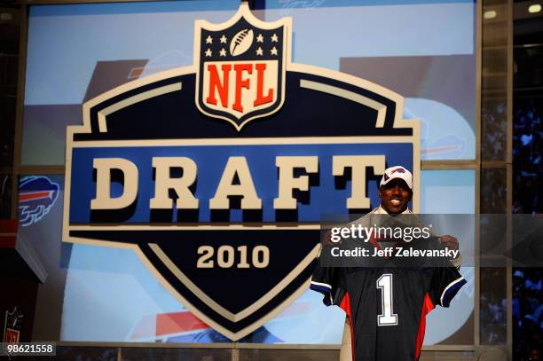 Spiller from the Clemson Tigers holds up a Buffalo Bills jersey after he was selected overall by the Bills during the first round of the 2010 NFL...