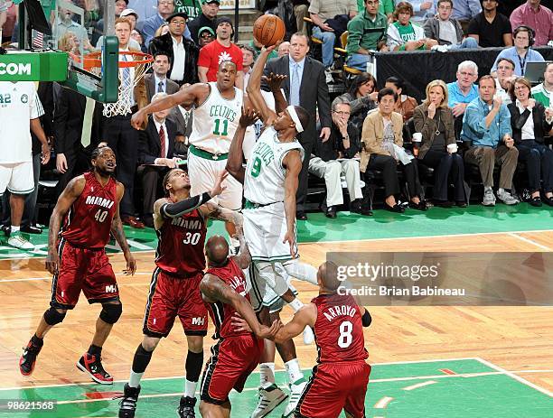 Rajon Rondo of the Boston Celtics goes up for a shot against Michael Beasley, Quentin Richardson, Carlos Arroyo and Udonis Haslem of the Miami Heat...