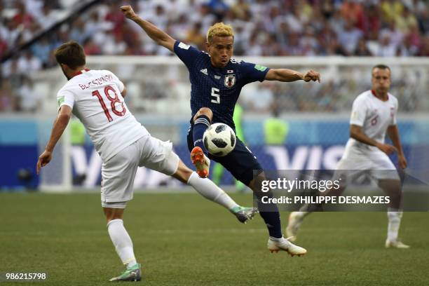 Japan's defender Yuto Nagatomo controls the ball during the Russia 2018 World Cup Group H football match between Japan and Poland at the Volgograd...