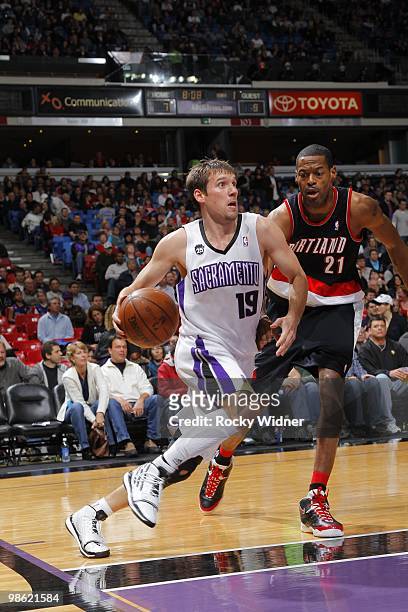 Beno Udrih of the Sacramento Kings dribble drives baseline to the basket against Marcus Camby of the Portland Trail Blazers on March 12, 2010 at Arco...