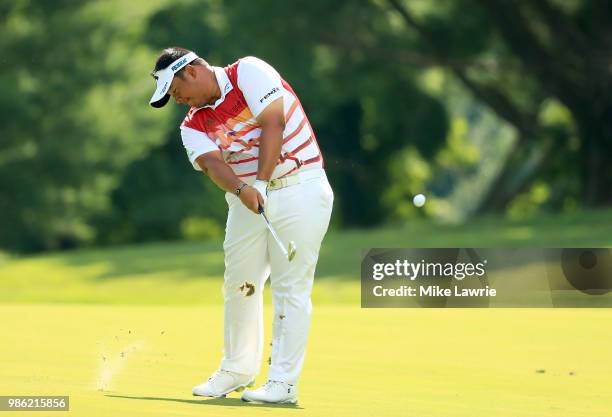 Kiradech Aphibarnrat of Thailand plays a shot on the 15th fairway during the first round of the Quicken Loans National at TPC Potomac on June 28,...