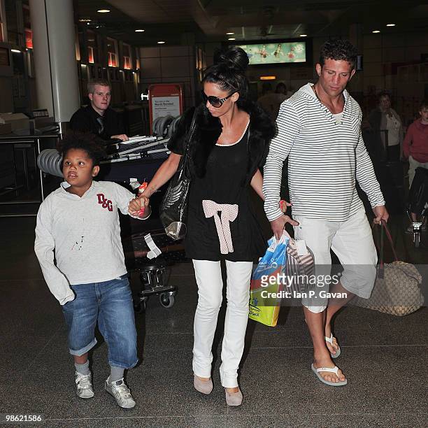 Katie Price, Alex Reid and family arrive at Gatwick airport after their holiday in Egypt on April 23, 2010 in London, England.