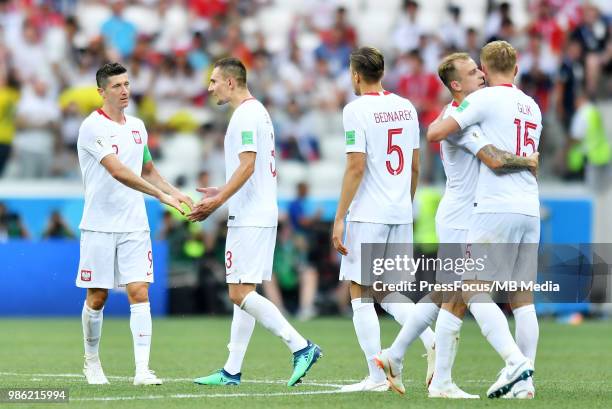 Robert Lewandowski and Artur Jedrzejczyk of Poland celebrate at full time during during the 2018 FIFA World Cup Russia group H match between Japan...