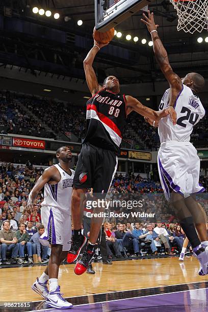 Nicolas Batum of the Portland Trail Blazers jumps to the basket for the slam dunk against Carl Landry of the Sacramento Kings during the game on...