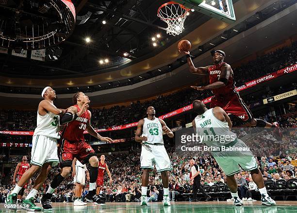 Jermaine O'Neal of the Miami Heat goes up for a shot against Glen Davis and Kendrick Perkins of the Boston Celtics in Game Two of the Eastern...