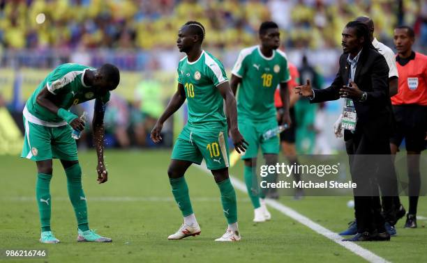 Aliou Cisse, Head coach of Senegal gives instructions to Cheikhou Kouyate and Sadio Mane of Senegal during the 2018 FIFA World Cup Russia group H...