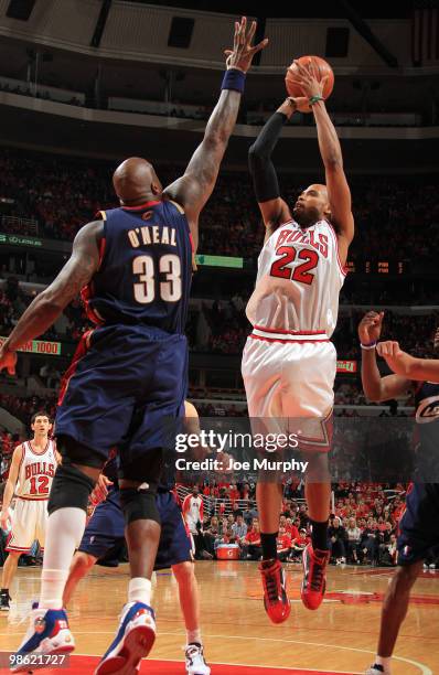 Taj Gibson of the Chicago Bulls shoots over Shaquille O'Neal of the Cleveland Cavaliers in Game Three of the Eastern Conference Quarterfinals during...