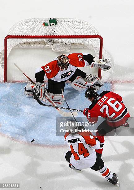 Brian Boucher and Kimmo Timonen of the Philadelphia Flyers stop a shot on goal by Patrik Elias of the New Jersey Devils in Game 5 of the Eastern...