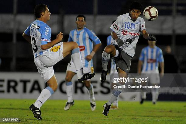 Walter Ibanez of Uruguay's Cerro vies for the ball Robin Rojas of Ecuador's Emelec during their Libertadores Cup match at the Centenario Stadium on...