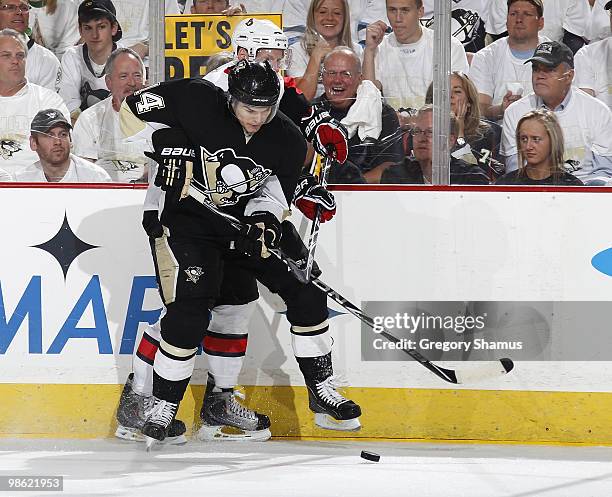 Chris Kunitz of the Pittsburgh Penguins battles for the puck against an Ottawa Senators defender in Game Five of the Eastern Conference Quaterfinals...