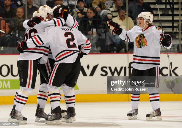 Duncan Keith of the Chicago Blackhawks celebrates with his teammates after a goal was scored against the Nashville Predators in Game Four of the...