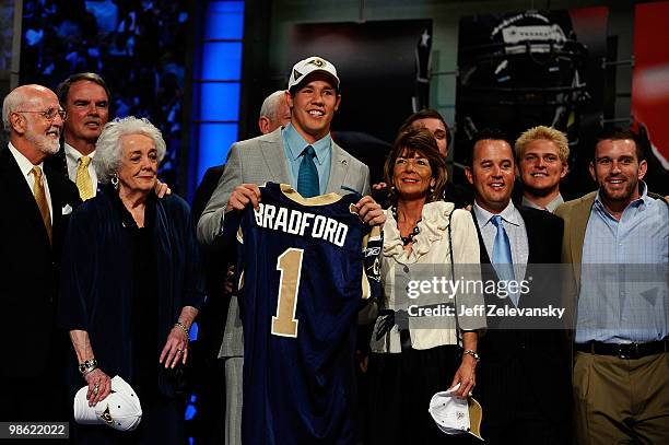 Quarterback Sam Bradford of the St. Louis Rams poses with family members and friends after he was selected number 1 overall out of the University of...