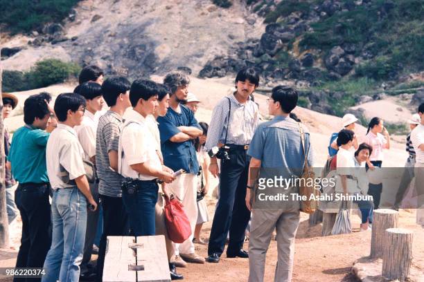 Prince Fumihito is seen with his friends during their trip at Goshogake hot spring on August 11, 1987 in Hachimantai, Akita, Japan.