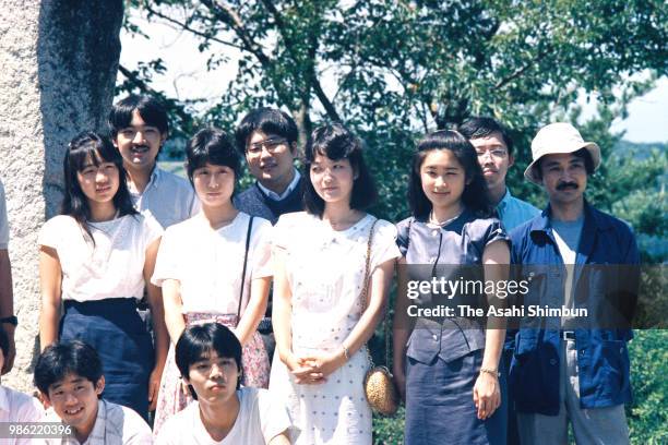 Prince Fumihito and Kiko Kawashima are seen with their friends during their trip in front of the Takuboku Ishikawa memorial on August 12, 1987 in...