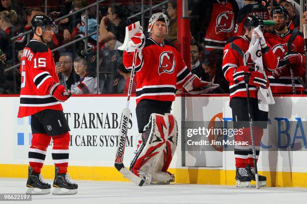 Jamie Langenbrunner, Martin Brodeur and Paul Martin of the New Jersey Devils look on against the Philadelphia Flyers in Game 5 of the Eastern...