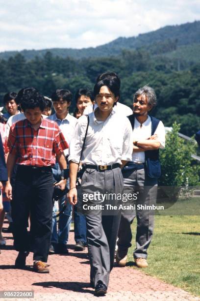 Prince Fumihito is seen with his friends during their trip on August 12, 1987 in Tamayama, Iwate, Japan.