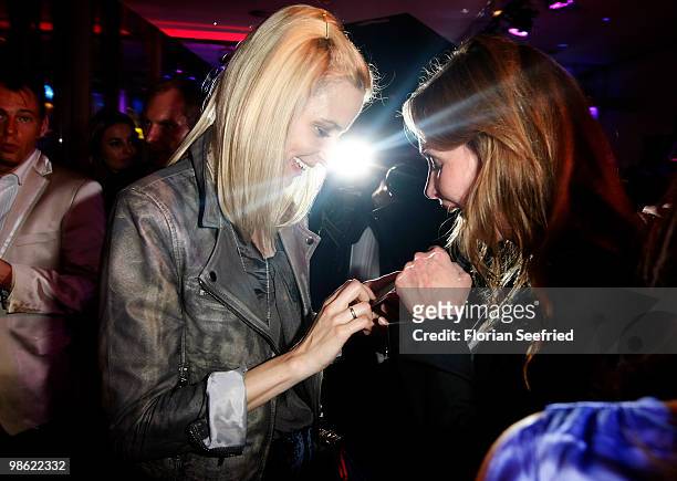 Model Eva Padberg and actress Simone Hanselmann attend the 'new faces award 2010' at cafe Moskau on April 22, 2010 in Berlin, Germany.