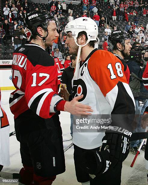 Mike Richards of the Philadelphia Flyers is congratulated by Ilya Kovalchuk of the New Jersey Devils after the Flyers defeated the Devils in Game...