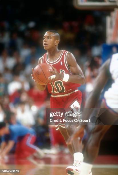 Armstrong of the Chicago Bulls looks to pass the ball against the Washington Bullets during an NBA basketball game circa 1990 at the Capital Centre...