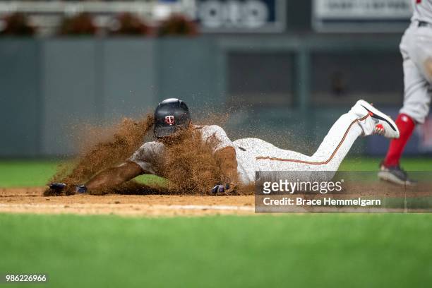 Eduardo Escobar of the Minnesota Twins slides against the Boston Red Sox on June 19, 2018 at Target Field in Minneapolis, Minnesota. The Twins...